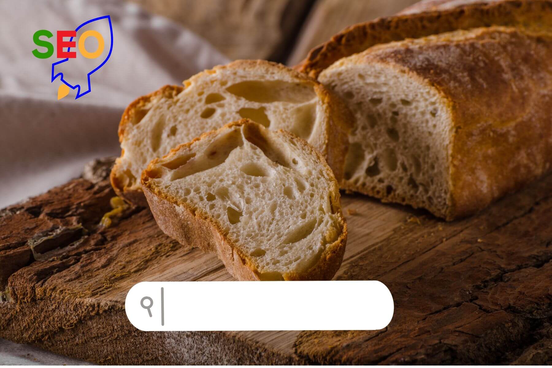 Eski ahşap bir tahtanın üzerinde taze bir ekmek var. İki dilim dilimlenip ekmeğin önüne konulmuş. Önünde arama motoru çubuğu ve SEO logosu var.